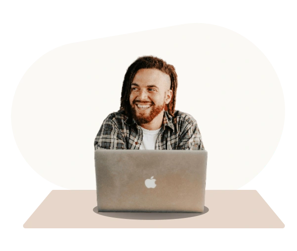 Smiling man at laptop